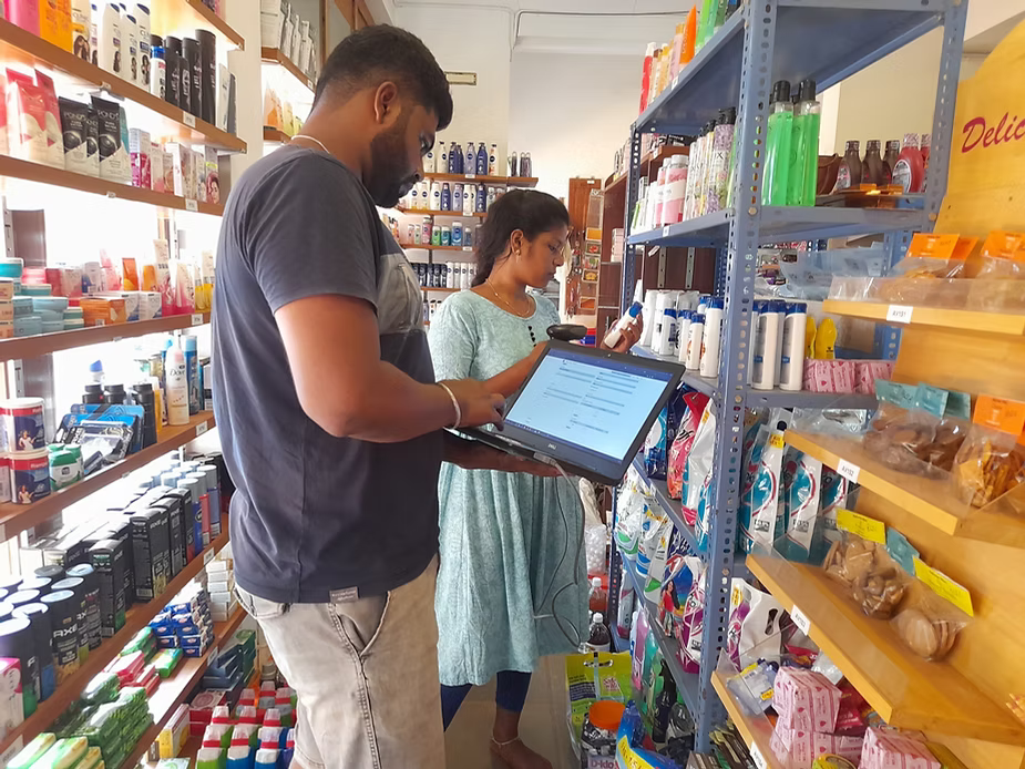 Ajay with his Yuvabe colleague at HERS, Auroville,, building an ERP system