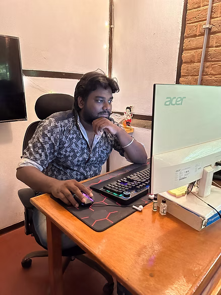 Yuvabe alumini Balamurugan at his work desk