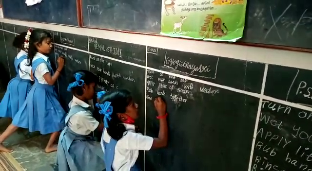 Students at Isai Ambalam School learning English