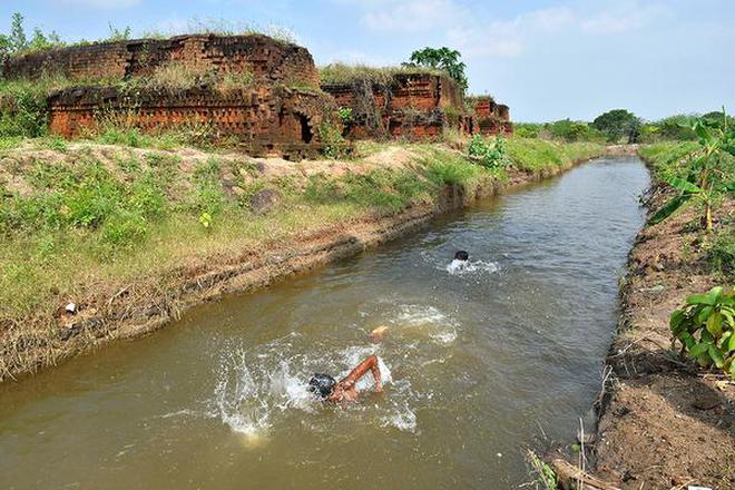 Community project: Children enjoying a swim in the restored Villupuram channel. | Photo Credit: KUMAR SS/The Hindu 