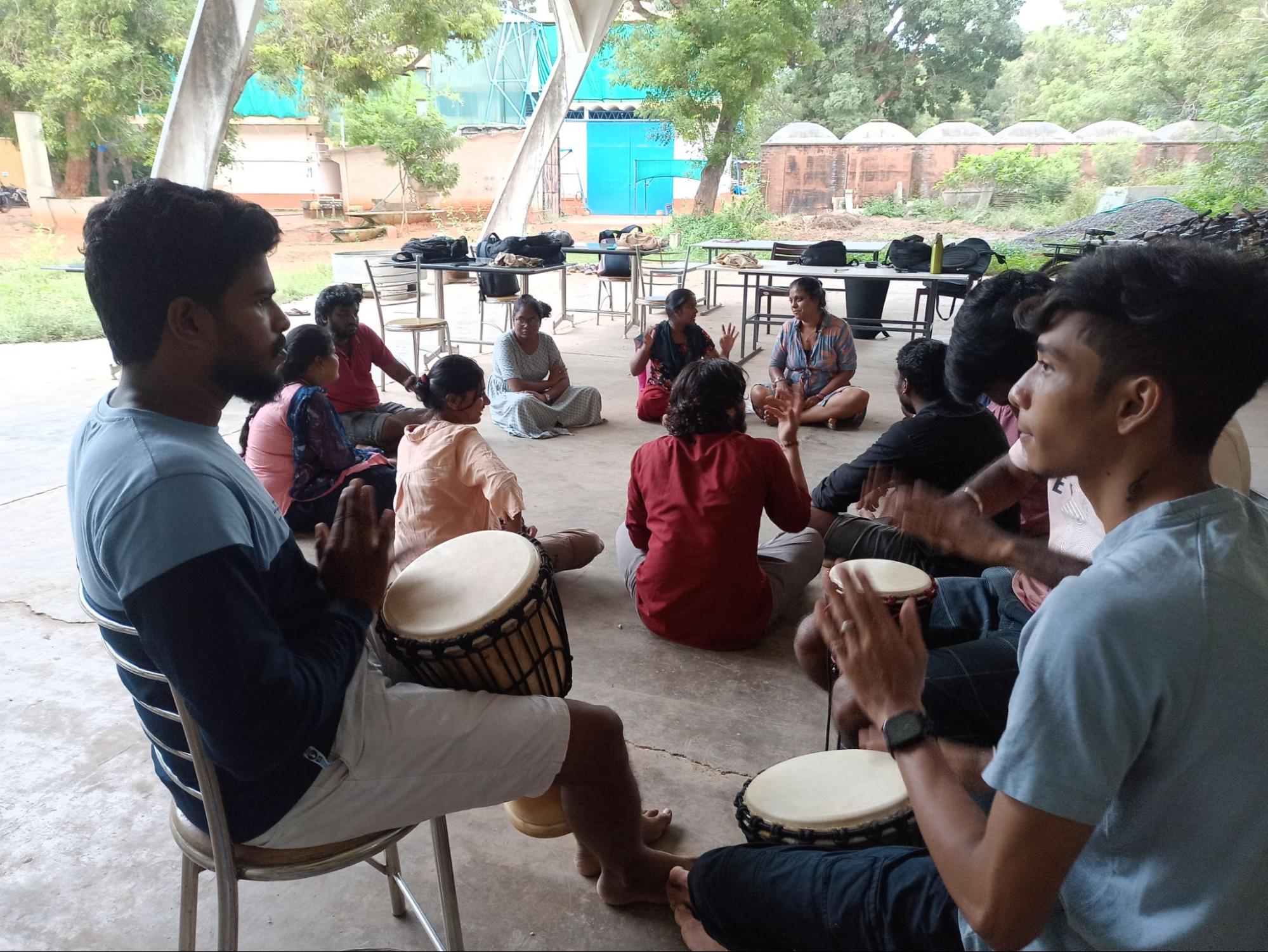 Yuvabe team practising for the play at Kinisi's parking space