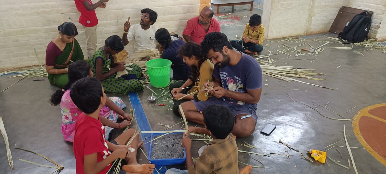 Making palm leaf crafts at Isai Ambalam School