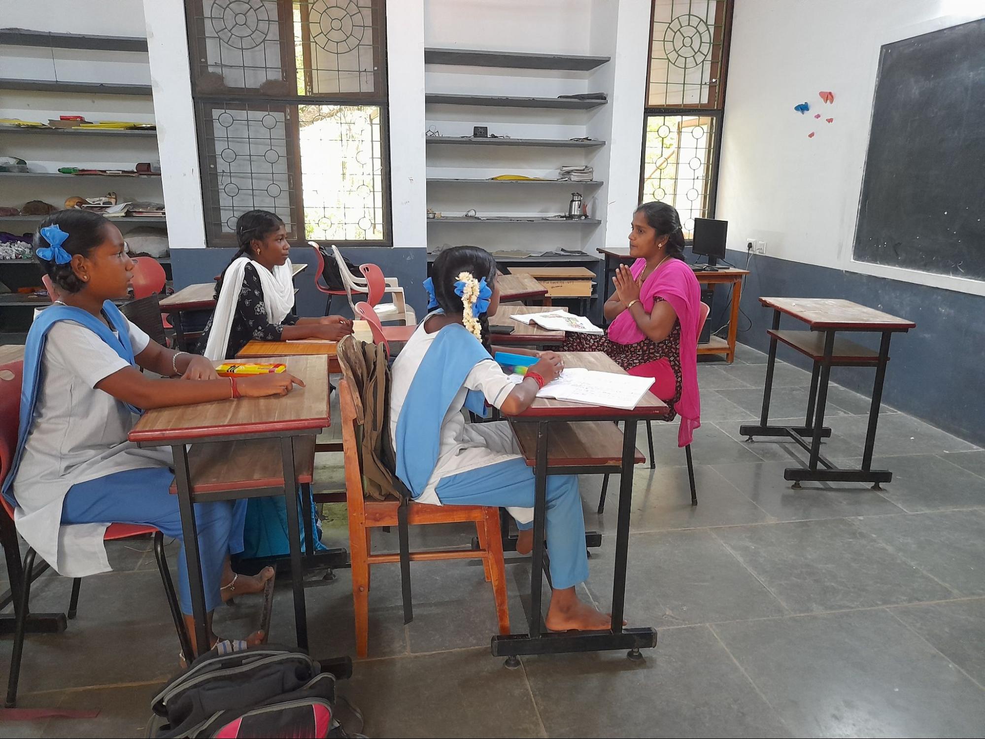 Bhuvana, market researcher at Yuvabe, teaches English to 6th standard students of Isai Amabalam School, one of Auroville's outreach schools.