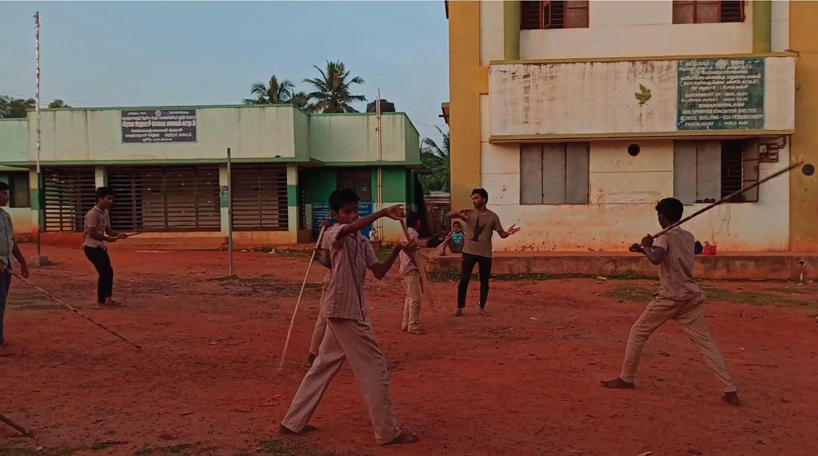 Vigneshwaran with his Silambam students in Pondicherry