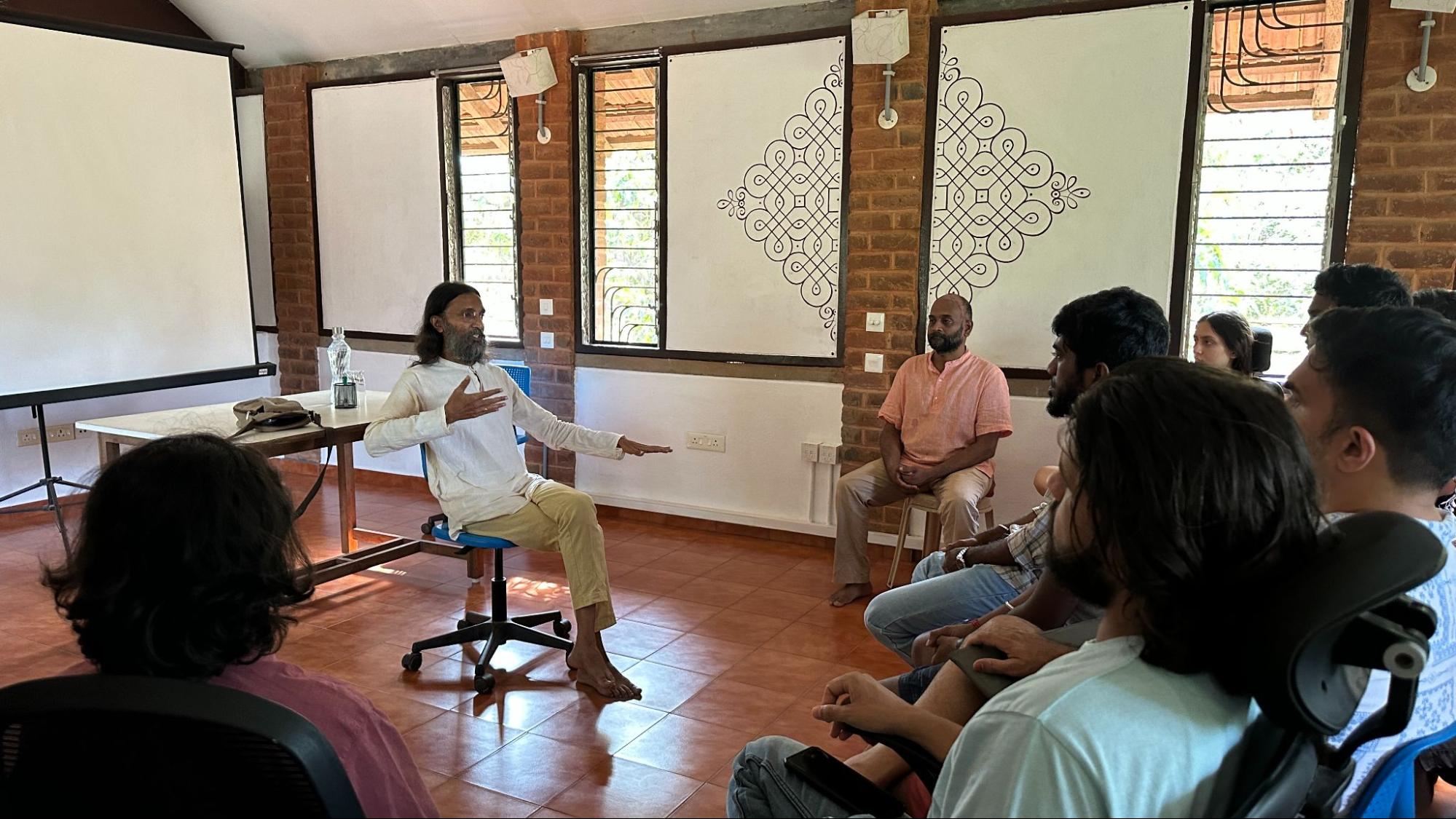 Manoj Pavithran having a discussion with members of Yuvabe.