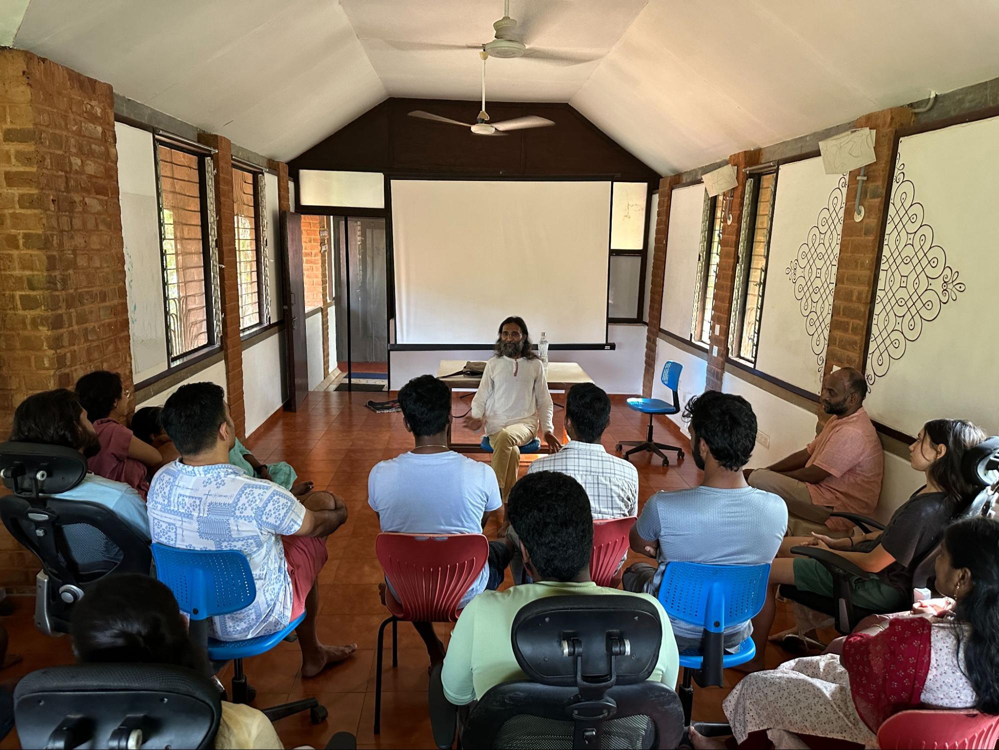 Manoj Pavithran having a discussion with members of Yuvabe.